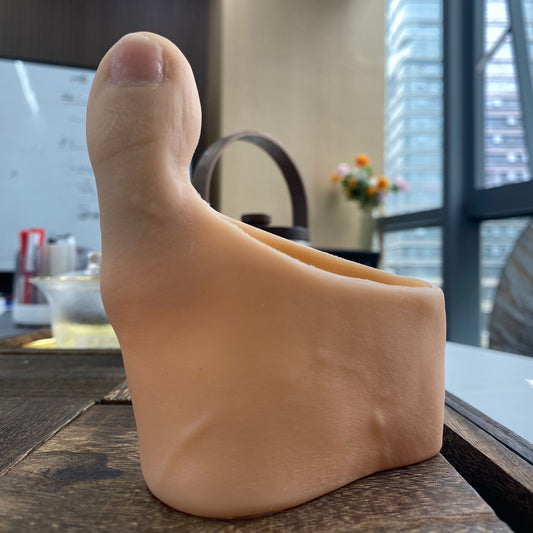 Attached prosthetic toe